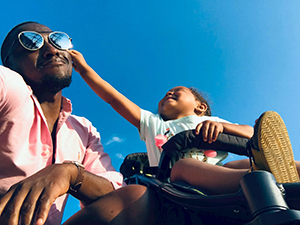black child playing with black adult